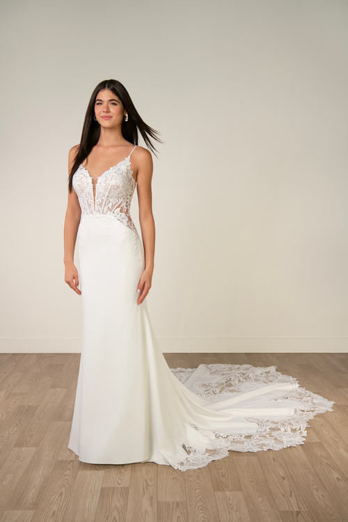 model is wearing a sleeveless fit and flare bridal gown
