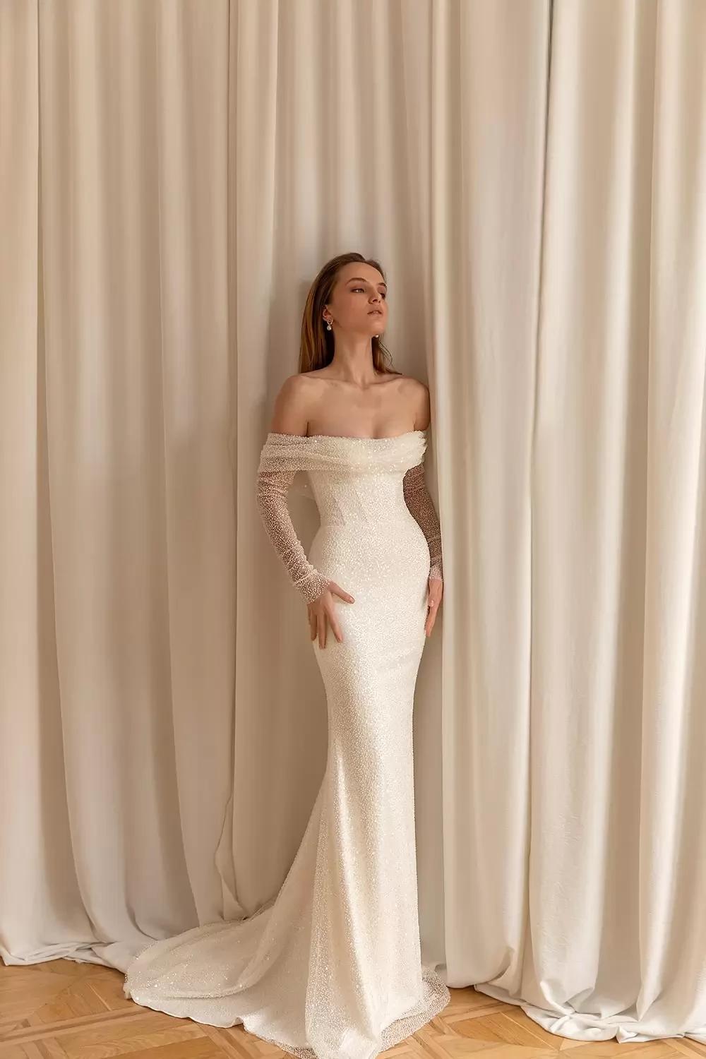 Model wearing a white bridal gown