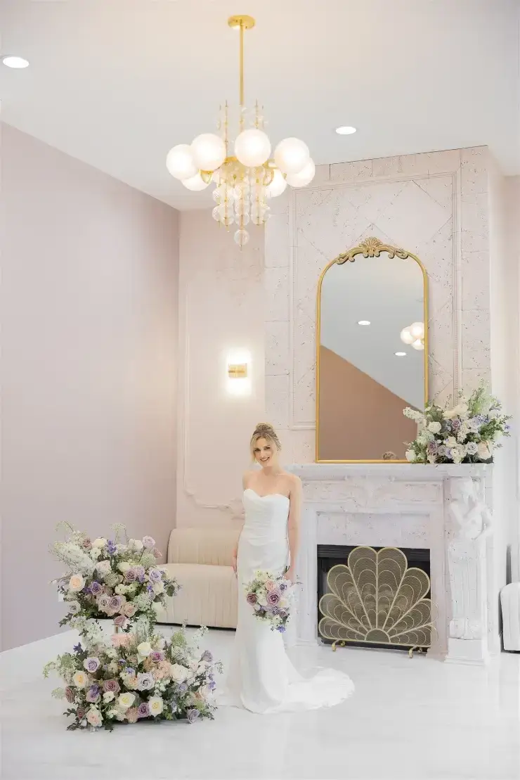 model is wearing a sleek strapless fit and flare wedding dress